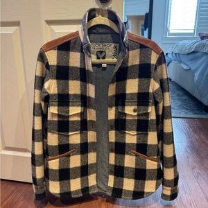 Tuck Shop Trading Co Black and White Plaid jacket with tan leather patches.